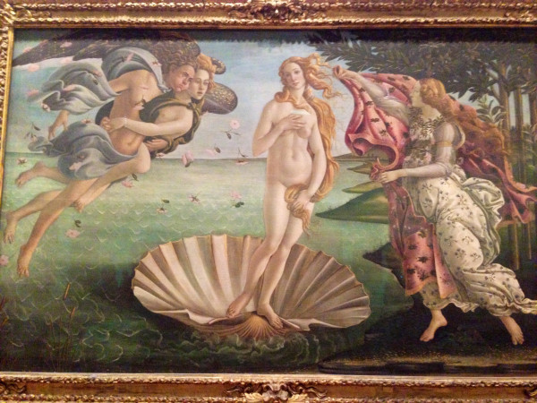A painting of venus in the center of a shell.