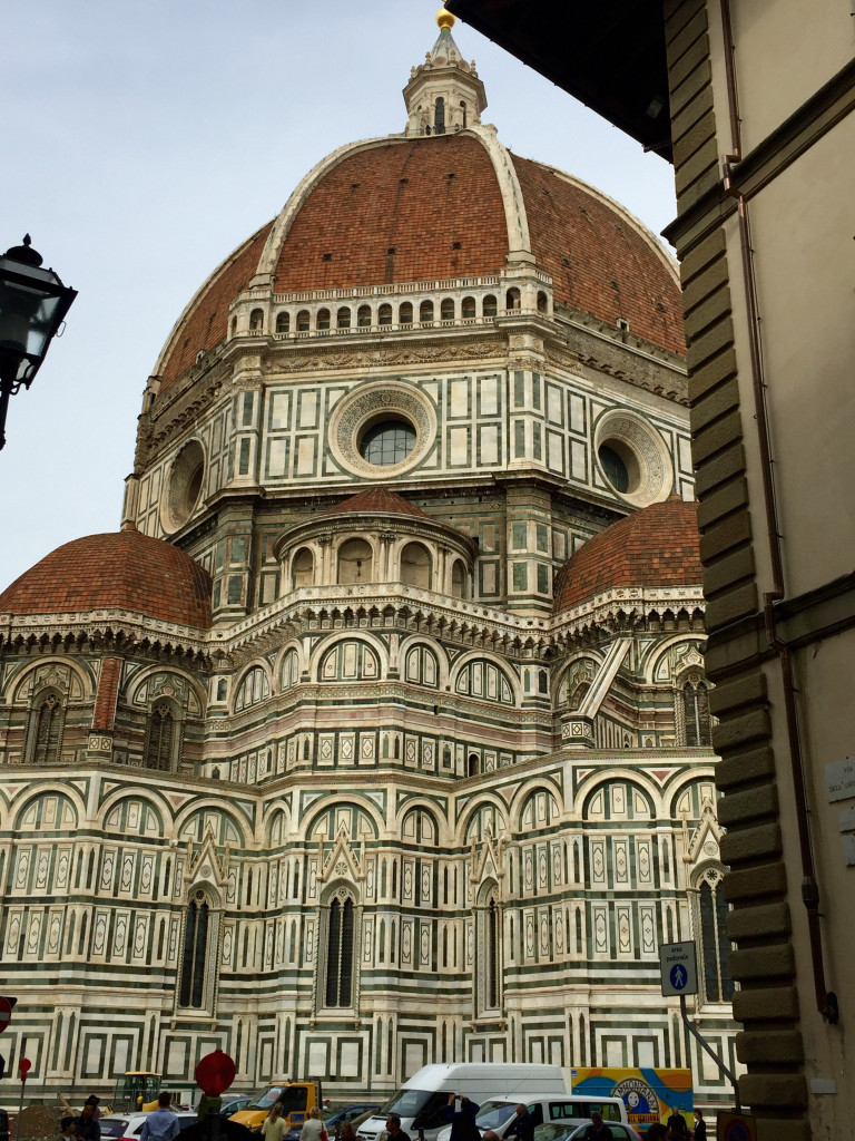 A large building with a dome like structure.