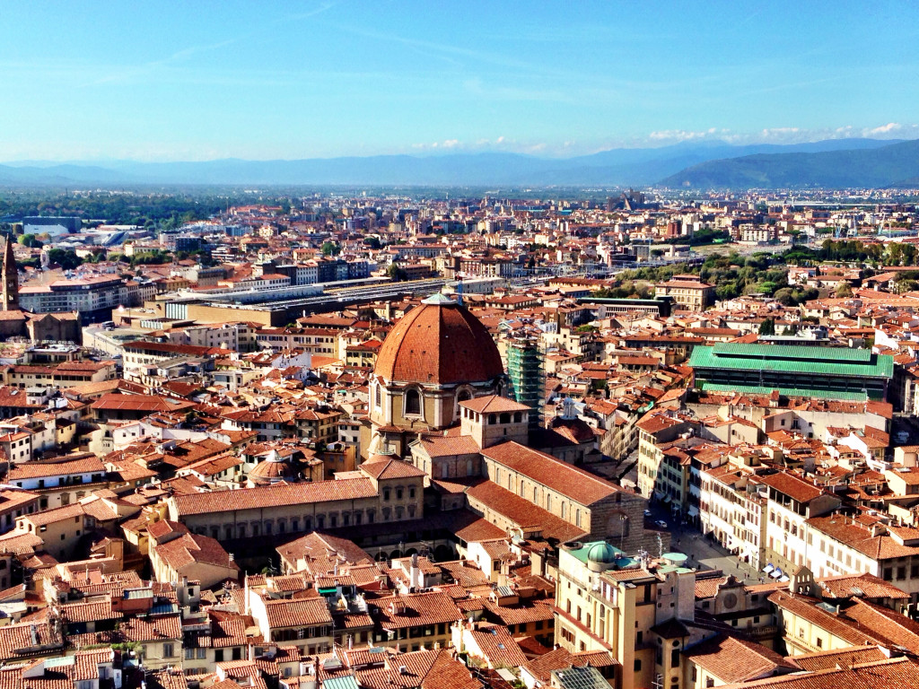 A view of the city from above, with a large dome in the center.