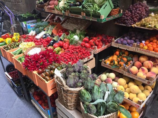 A market with lots of fresh fruits and vegetables.