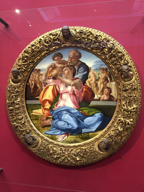 A painting of the virgin mary and jesus in a gold frame.
