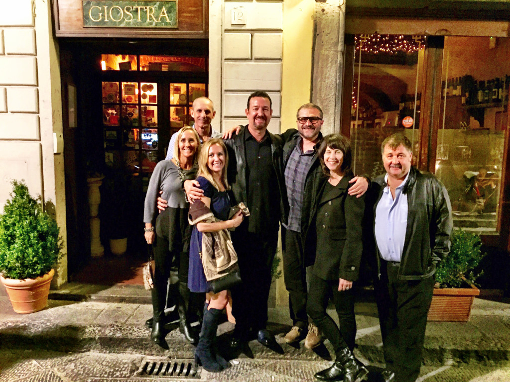 A group of people standing in front of a building.